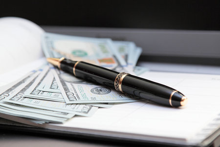 Ballpoint pen on the background paper banknotes  Horizontalの写真素材