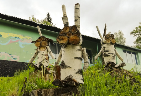 handicraft of birch logs. hares made of wood. wood decor.の写真素材