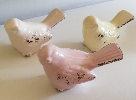 Love ceramics porcelain painted birds on white wooden background.の写真素材