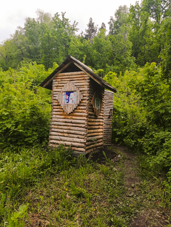 toilet in nature among the trees. toilet made of wood.の写真素材