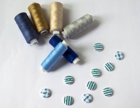 tools for sewing and needlework. hobby. multi-colored sewing thread. buttons