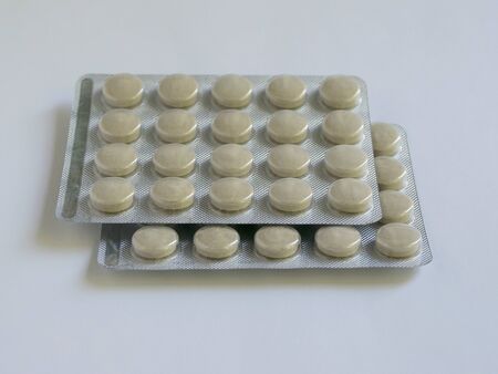 
Tablets in packs are on the table. Antibiotics from the virus. Treatment of the disease.の写真素材