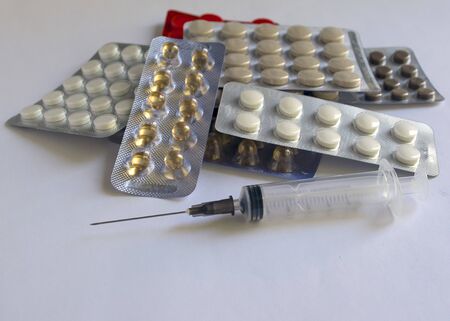 
Tablets in packs are on the table. Antibiotics from the virus. Treatment of the disease.の写真素材