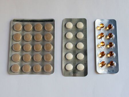 Tablets in packs are on the table. Antibiotics from the virus. Treatment of the disease.の写真素材