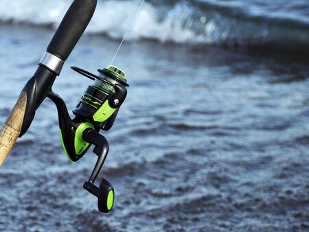 Tackle for fishing. Coil for a street or spinning. Camping. Fishing in the pondの写真素材