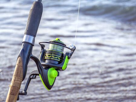 Tackle for fishing. Coil for a street or spinning. Camping. Fishing in the pondの写真素材