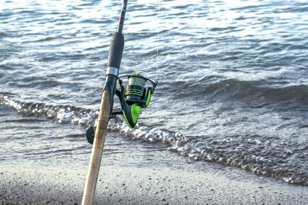 Tackle for fishing. Coil for a street or spinning. Camping. Fishing in the pondの写真素材