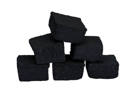 Black coal for a hookah. Ignition of a hookah. Coals for a hookah in fire and smoke. Black coals burn beautifullyの写真素材