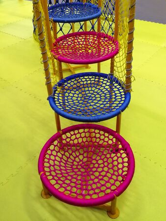 Ladder made of rings made of ropes in the playground. Swing nest. A circle. Active children's leisure.の写真素材