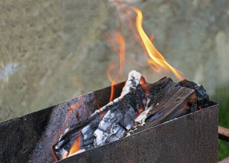 Fire and smoke. Barbecue firewood. Grill for frying meat. Bonfire on a picnic. Hot coals.
の写真素材