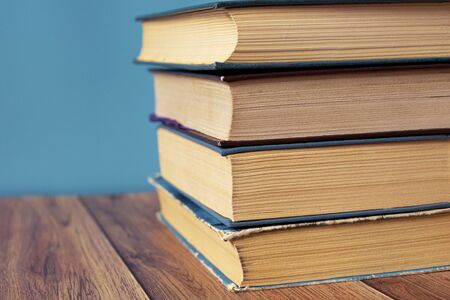 A stack of old books with yellow pages. Book binding. Knowledge and education. Literature in the library.
の写真素材