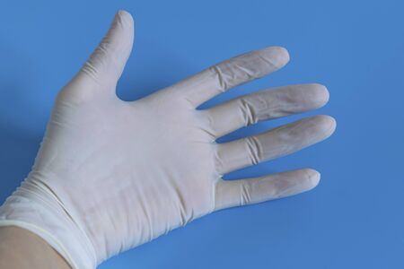 White disposable gloves. Hygiene and protection against diseases and viruses. Coronavirus.