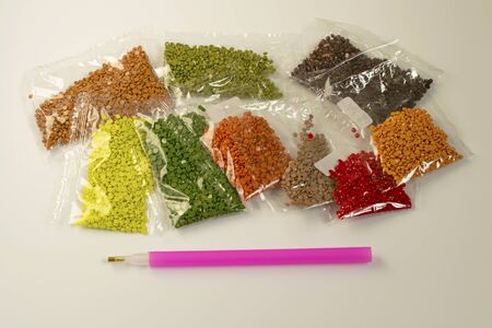 Diamond Mosaic by numbers. Acrylic rhinestones. A new trendy look for hobbies and art.の写真素材