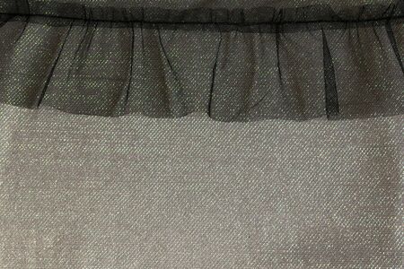 Abstract background texture of black tulle, shiny. Beautiful frillの写真素材