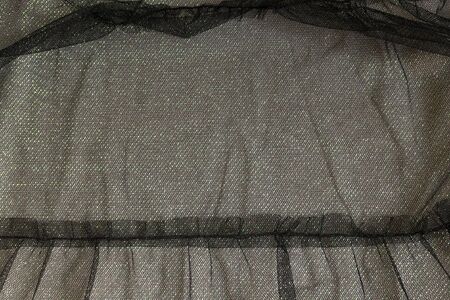 Abstract background texture of black tulle, shiny. Beautiful frillの写真素材