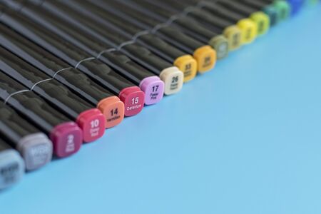 Multi-colored markers on a blue background. Marker for drawing and creativity.の写真素材