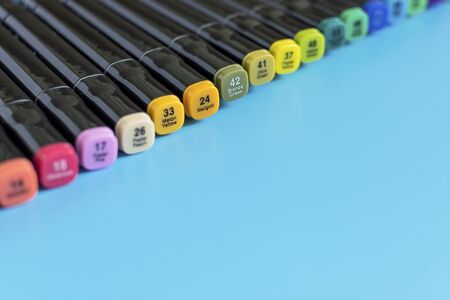 Multi-colored markers on a blue background. Marker for drawing and creativity.の写真素材