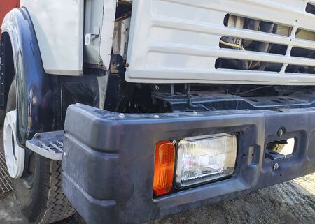 Different parts of a big truck. Headlight and bumper. Car repairの写真素材