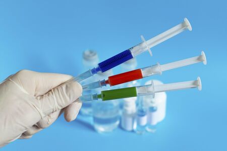 Vaccine and syringe for injection. Prevention, immunization and treatment of coronavirus infection, influenza, virus and bacteria. Medicine infectious concept.
の写真素材