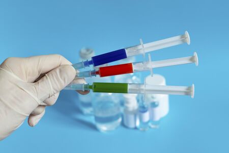 Vaccine and syringe for injection. Prevention, immunization and treatment of coronavirus infection, influenza, virus and bacteria. Medicine infectious concept.の写真素材