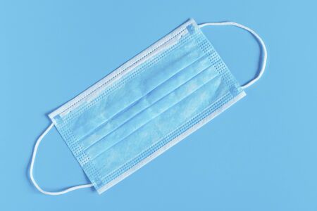 Surgical medical mask. Mask to protect the mouth and nose from bacteria
and the virus.の写真素材