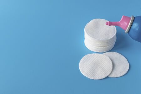 Cotton pads for skin care, for cleansing the face of cosmetics with tonic or micellar cleansing water. Cosmetic productsの写真素材