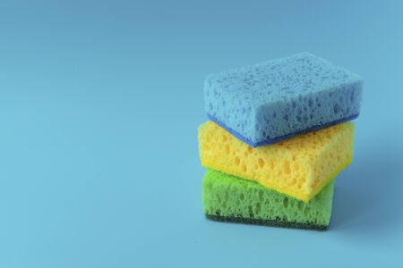 Sponge for washing dishes. Detergent for washing dishes. Spring cleaning at homeの写真素材