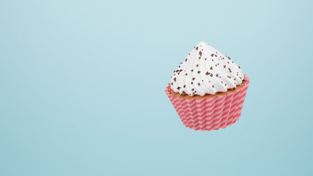 Single vanilla cupcake with a high cap of whipped white cream and chocolate chips. Cupcake with cream floating on blue background. pastel colors. 3d rendering.の写真素材