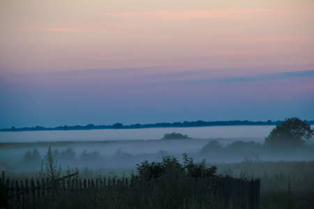 Fog at sunsetの写真素材