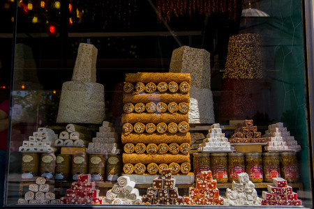 Traditional turkish delights sweets. Wide selection of exotic oriental sweets including baklava, toffees and crystallised fruits in the Spice Market in Istanbul, Turkey.の写真素材