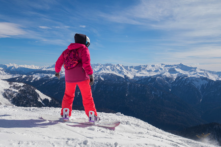 Snowboarder girl rides fast on loose snow Freeride. Rosa Khutor, Estosadok, Sochi, Russia, 17 March 2018の写真素材