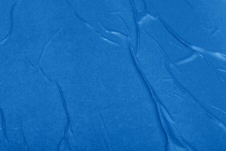 Blue empty crumpled and wet texture paper. Creased grunge paper background. Art rough stylized blank...