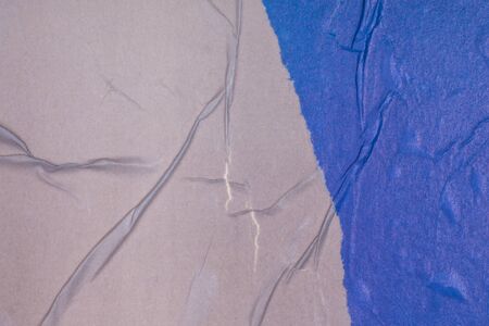 Empty crumpled and wet texture paper. Creased grunge paper background. Art rough stylized blank for a billboard, poster or banner with space for text. Copy space. Collage of blue and gray.の写真素材