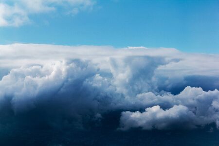 Blue sky with white clouds from the plane view.Cumulus clouds.の写真素材