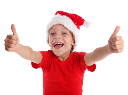 Happy child in christmas hat isolated on whiteの写真素材