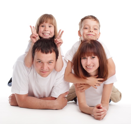 Happy family with two children isolated on whiteの写真素材
