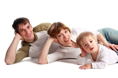 Happy family laying on a floorの写真素材
