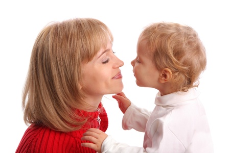 Baby kissing mum isolated on white の写真素材