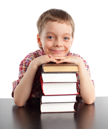 Smiling boy with set of booksの写真素材