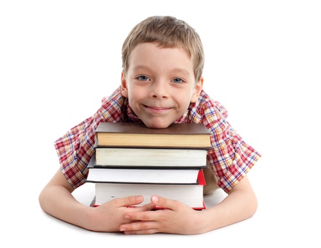 Smiling boy with set of booksの写真素材
