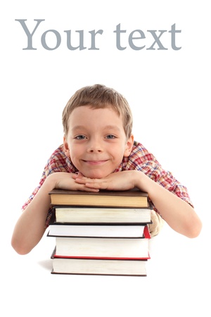 Smiling boy with set of booksの写真素材