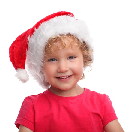 Child in a Christmas hat isolated on whiteの写真素材