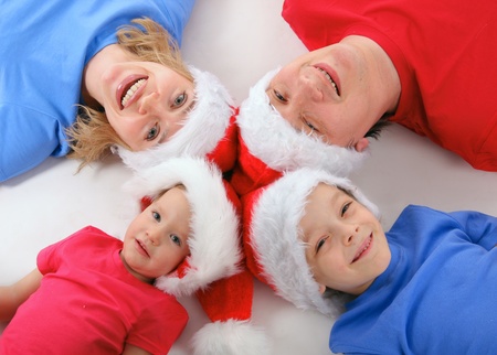 Happy family in Christmas hats の写真素材