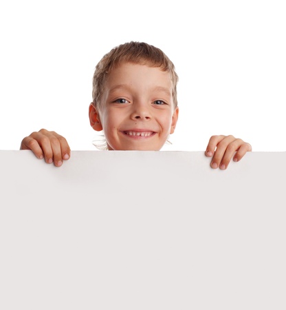 Happy boy with the empty blank isolated on whiteの写真素材