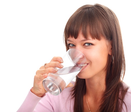 Young woman drinking water from a glassの写真素材