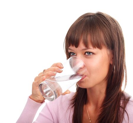 Young woman drinking water from a glassの写真素材