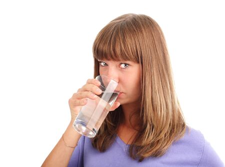 Young woman drinking water from a glassの写真素材