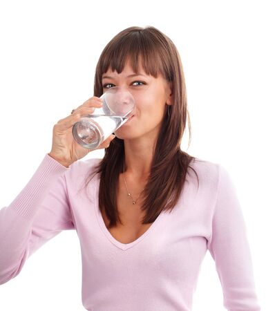 Young woman drinking water from a glassの写真素材