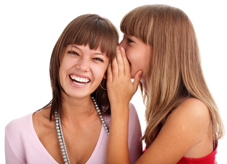 woman tells to the girlfriend good newsの写真素材