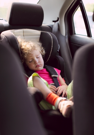 child sleeps in the carの写真素材